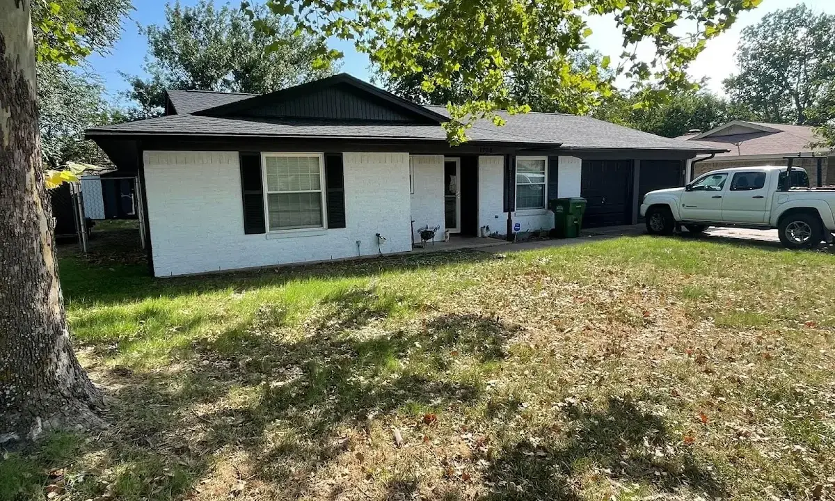 Professional roofing crew working on a residential roof in Braddock